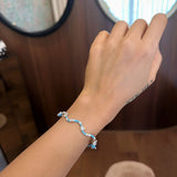 Multi shape wavy bangle